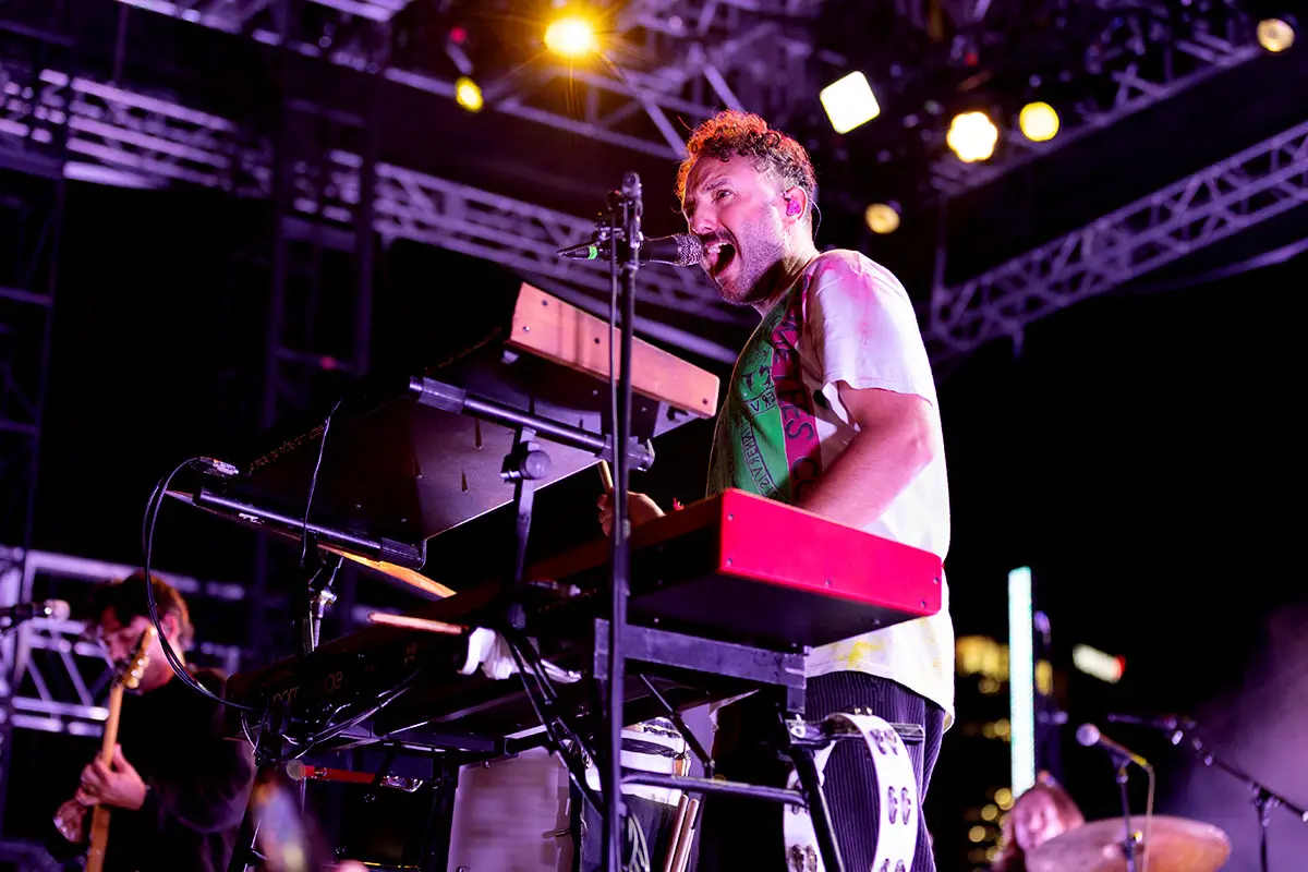 Local Natives' Kelcey Ayer on keyboard playing a sold out show at New York's Pier 17.