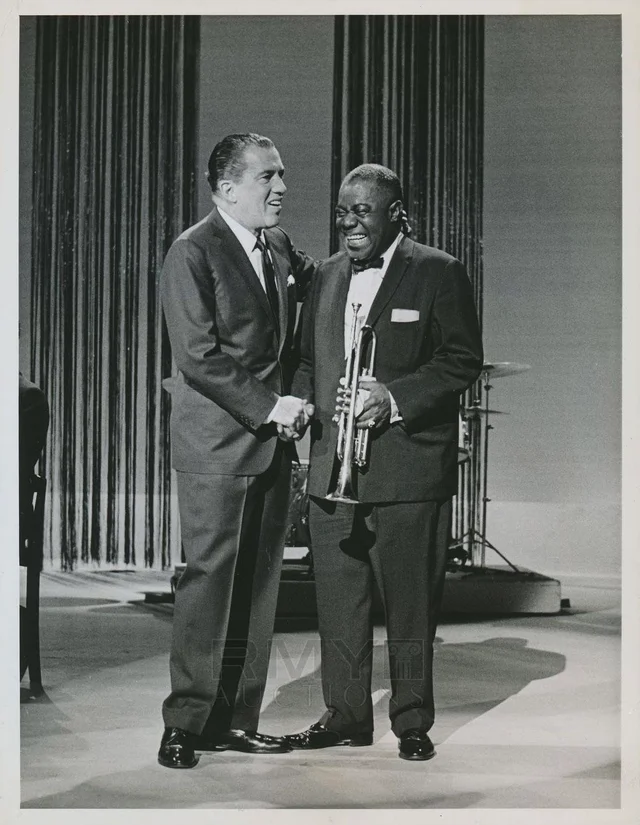 Louis Armstrong and Ed Sullivan.