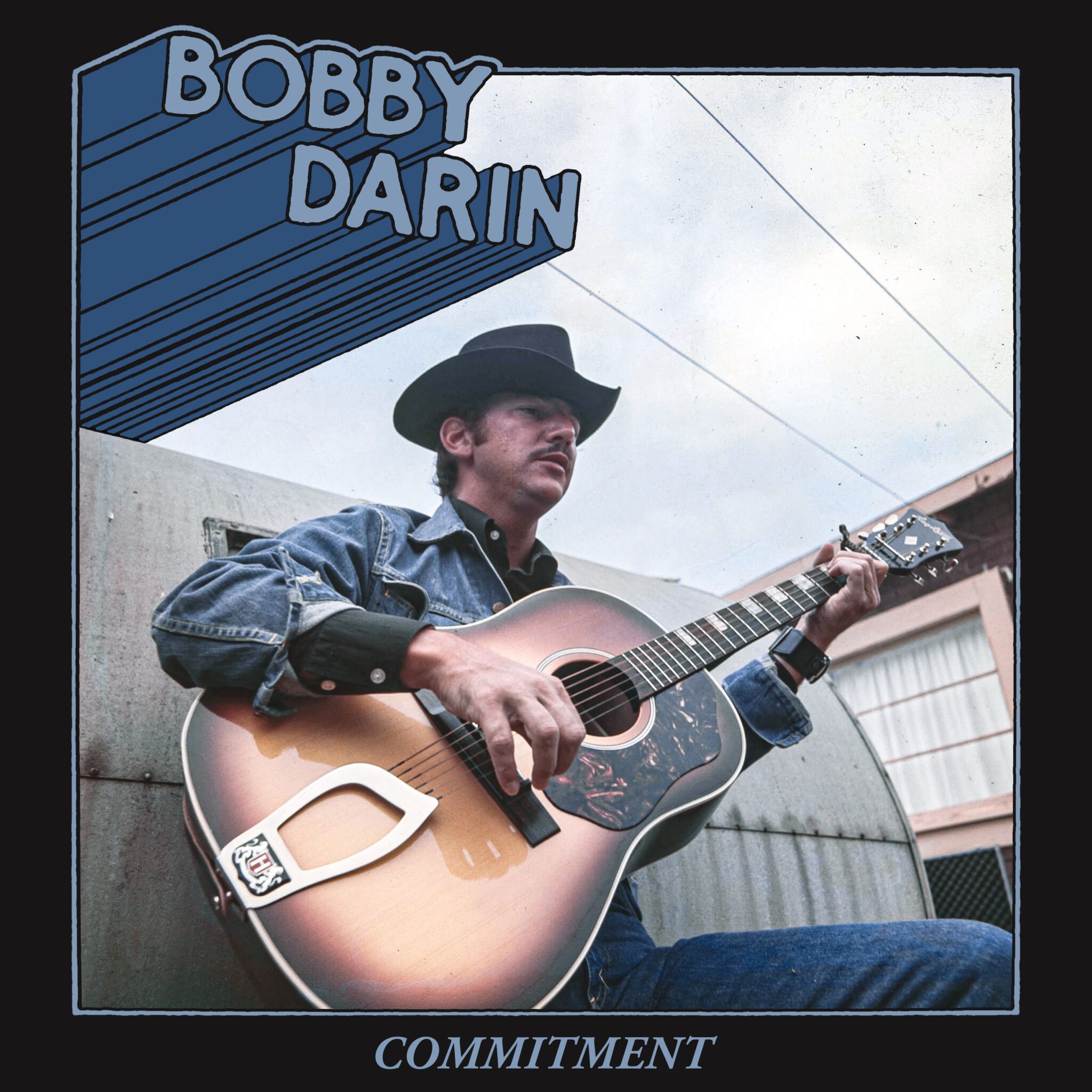 Bobby Darin in denim playing guitar