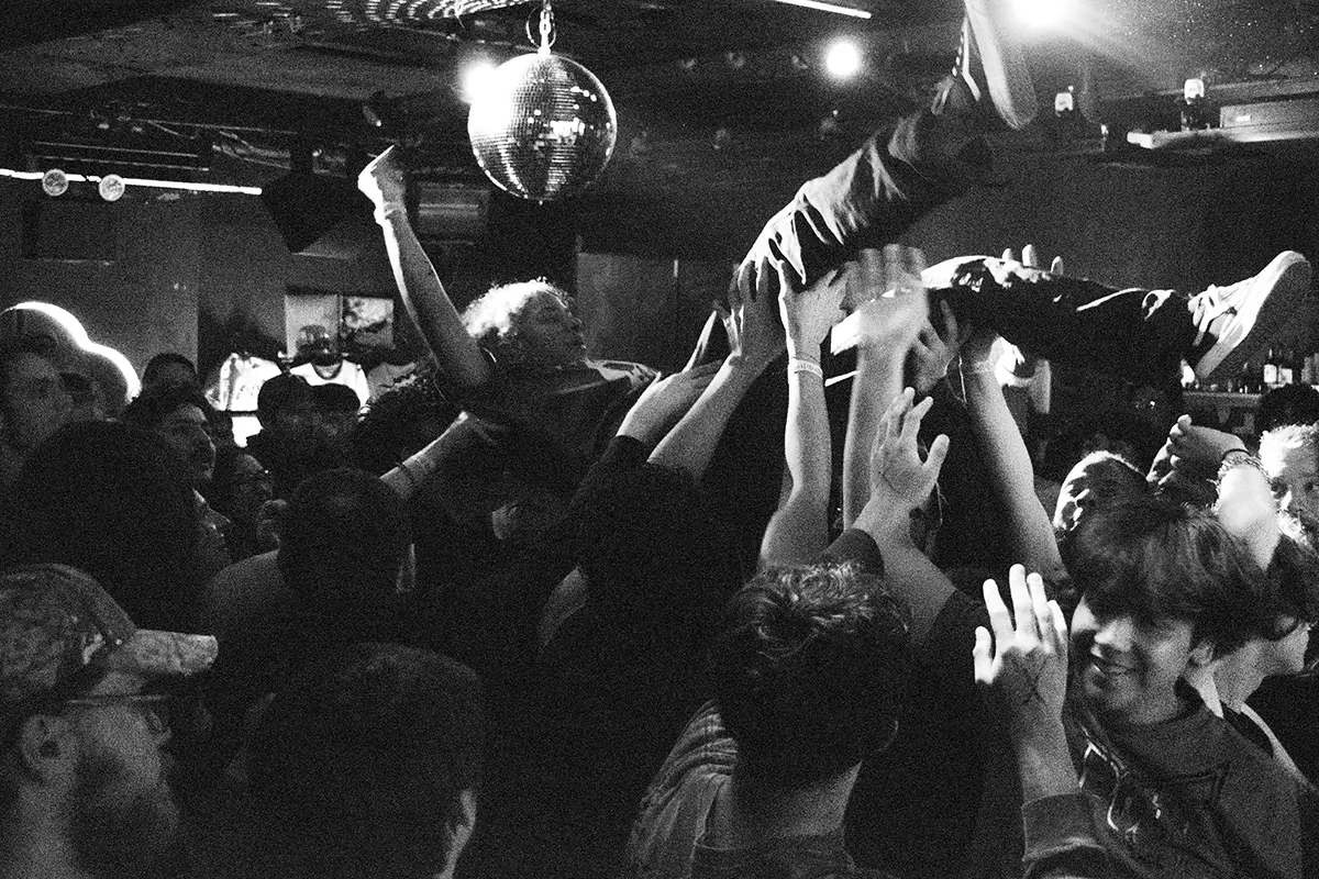 more crowd surfing, hands in air during heart to gold's performance