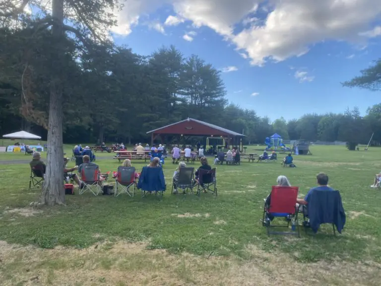 people in coeymans park watching evening on the green