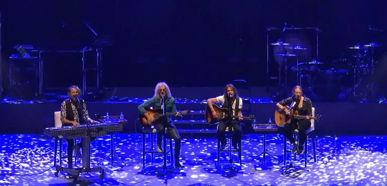 Members of Foreigner playing on stage