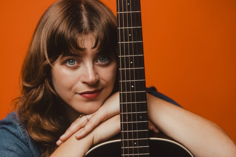 sarah gross portrait with guitar