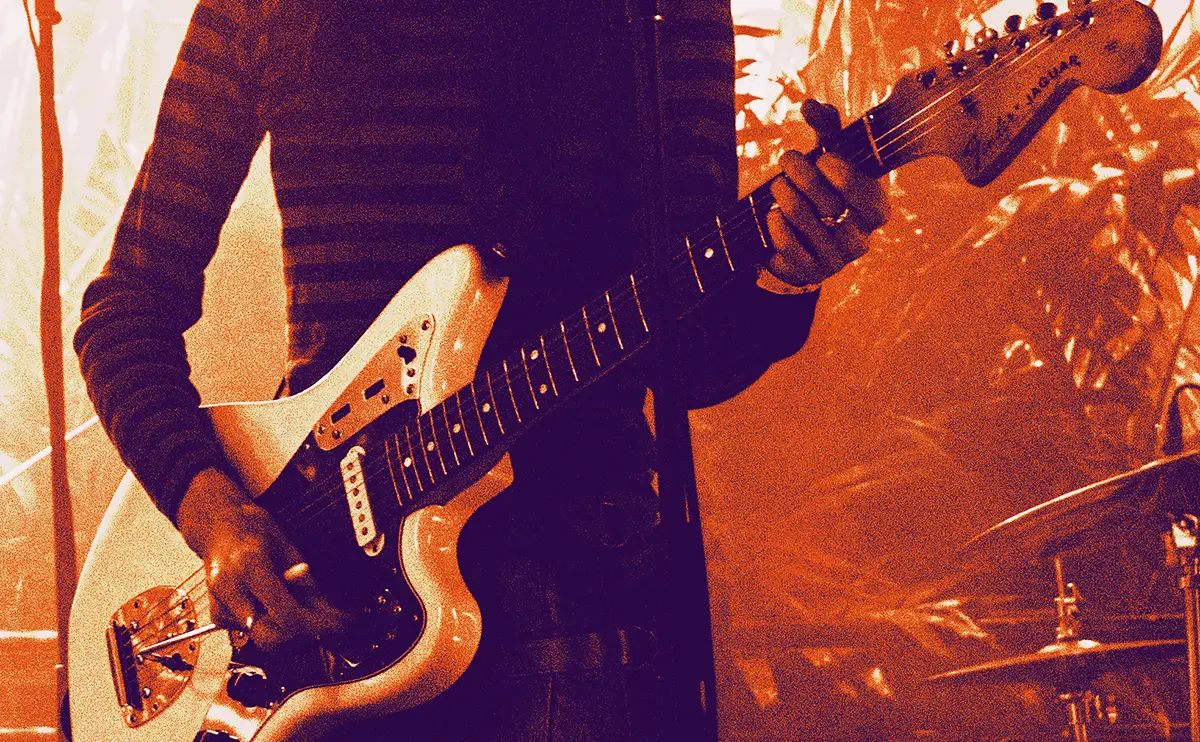 close up of maria somerville and her guitar