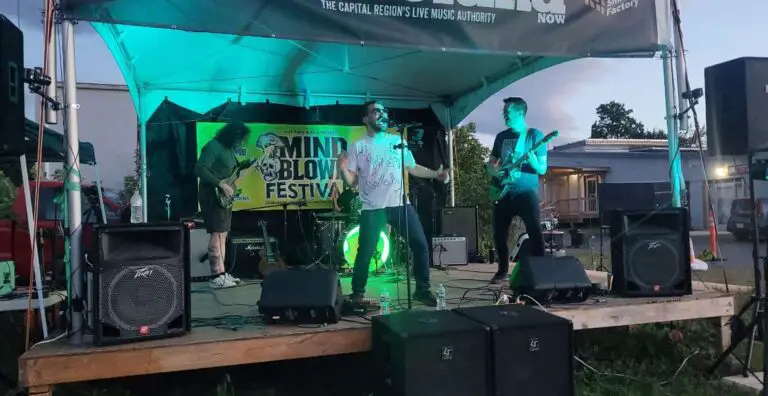 photo of james mullen on stage with his former band, seize atlantis